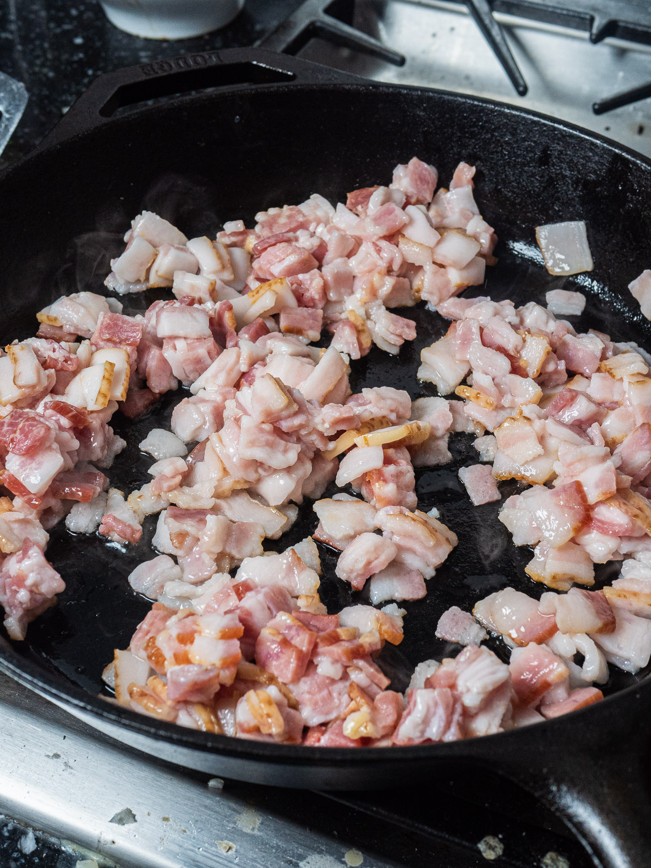 Add bacon to a large skillet and turn the heat onto medium. Cook, stirring occasionally until it’s just starting to crisp. Remove the bacon to a paper-towel-lined plate and set aside.