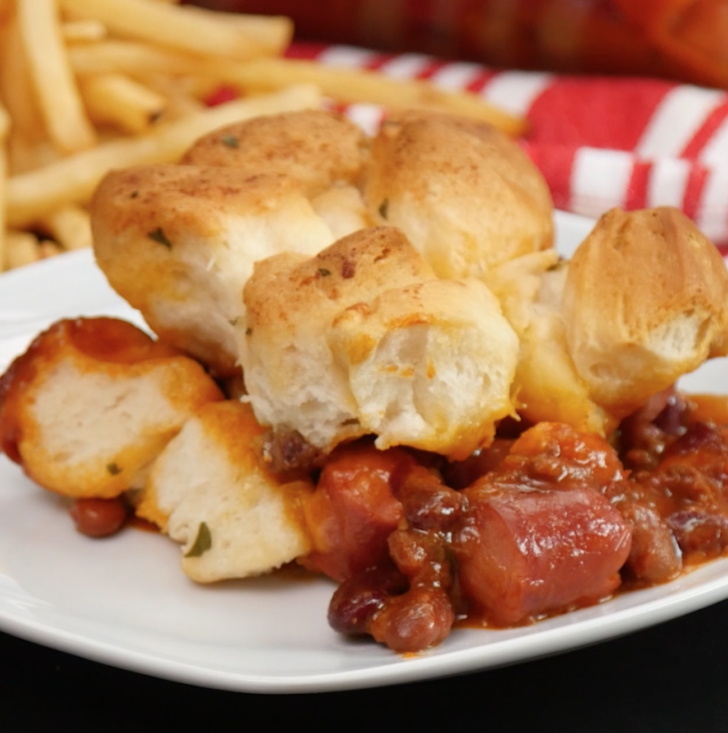 Close up of biscuits, hot dogs, and chili bake