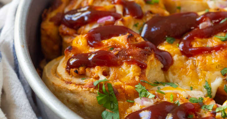 A pan with cheesy BBQ Pizza rolls inside