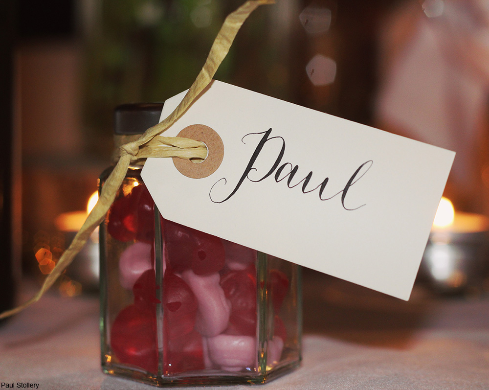 jar full of candy with a ribbon and nametag