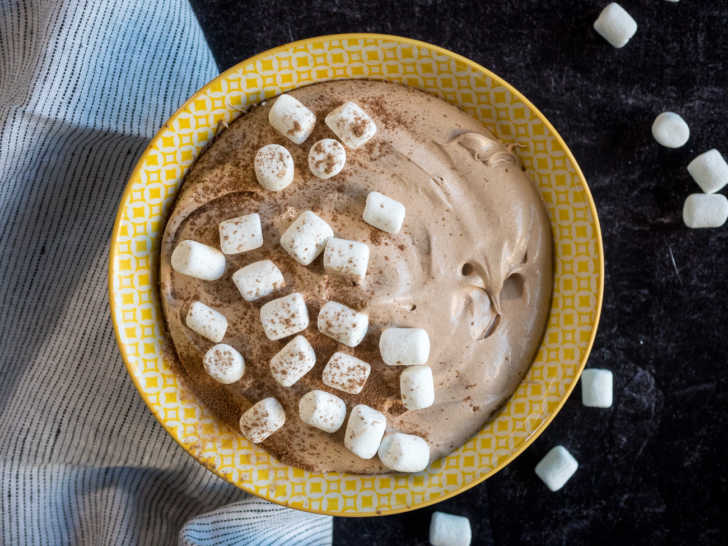 Hot chocolate dip close up with marshmallows and cocoa