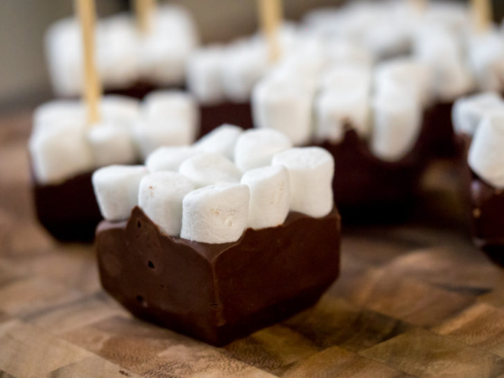 Hot chocolate fudge squares with marshmallows on a stick