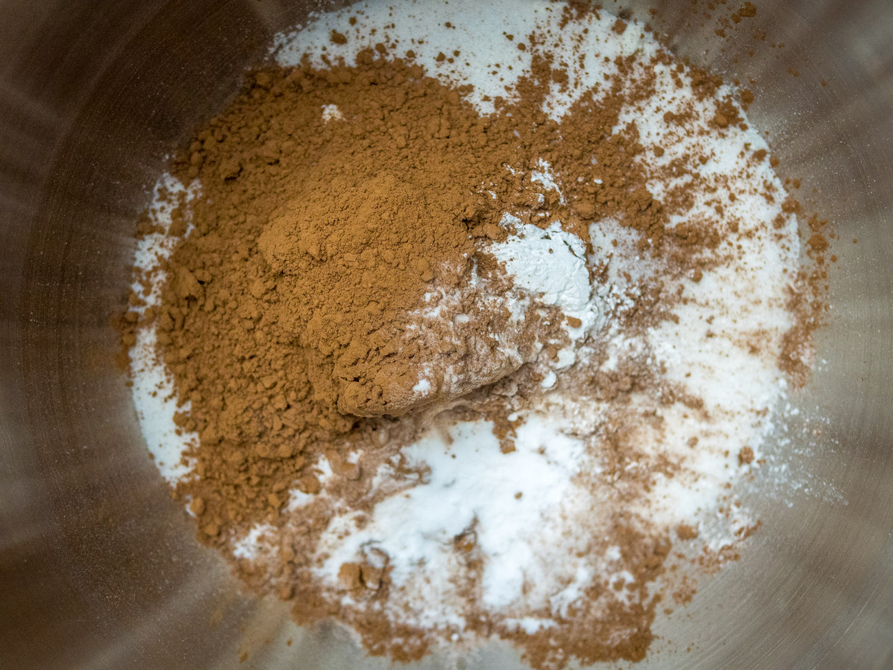 Combine flour, sugar, cocoa powder, baking powder, and baking soda in a large bowl.
