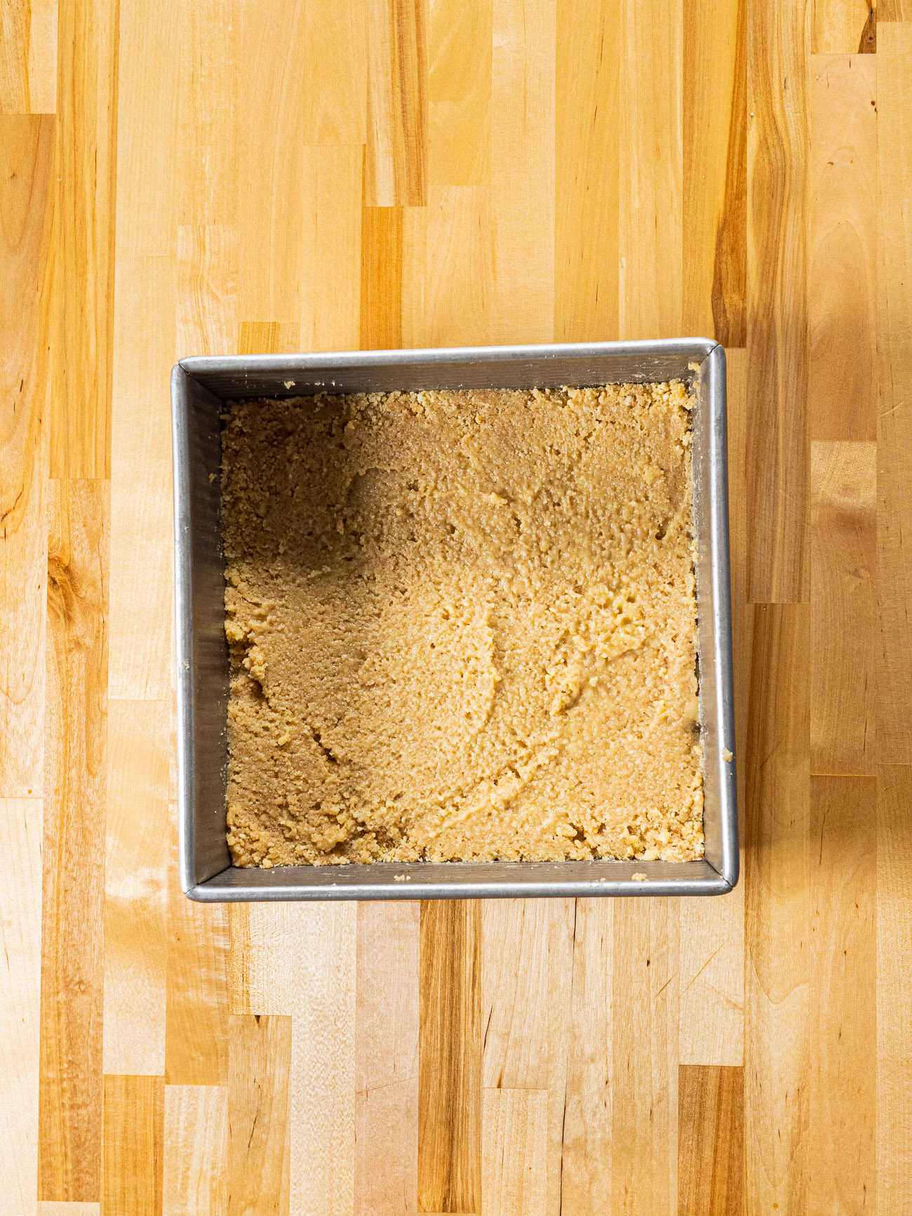 Press the shortbread mixture into the pan in an even layer. Refrigerate until firm.