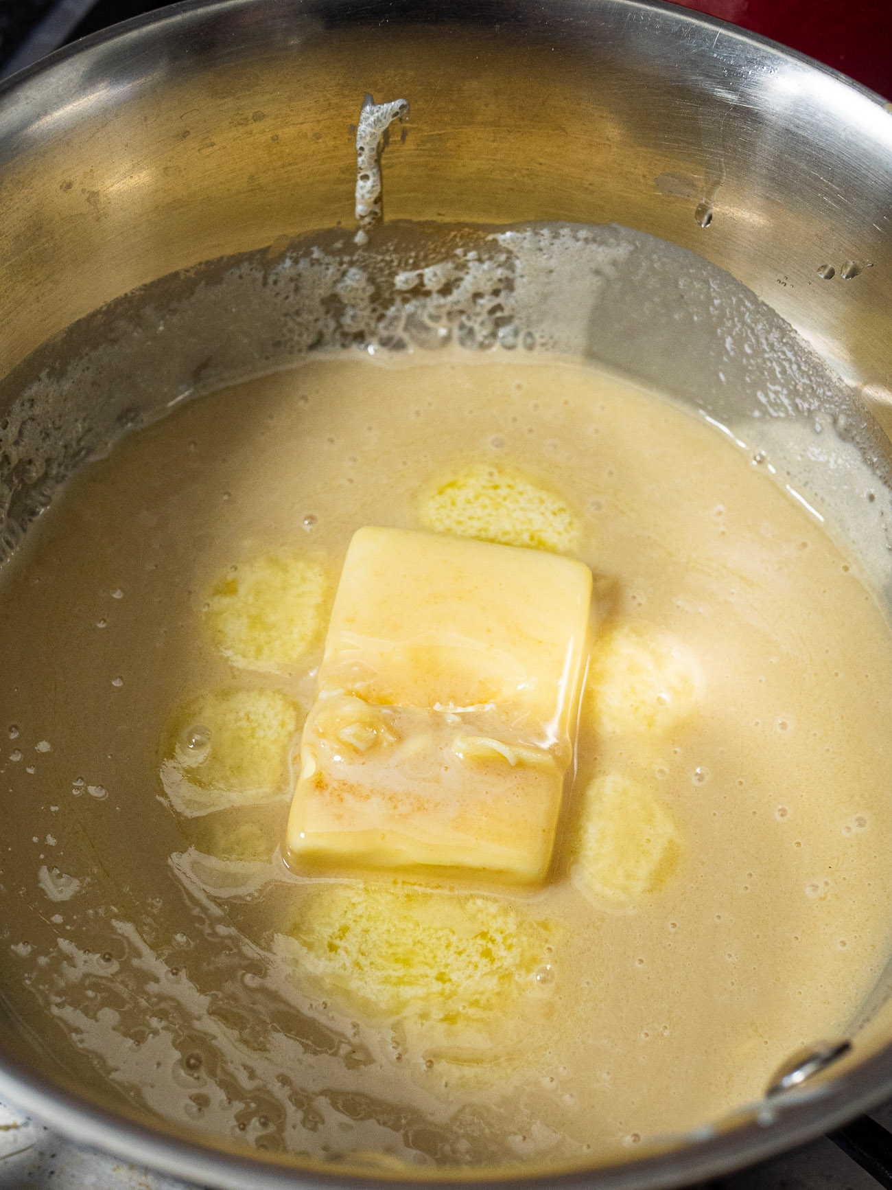 Add brown sugar, butter, and sweetened condensed milk to a small saucepan and bring to a boil. Reduce the heat to low and simmer until thickened while stirring often.