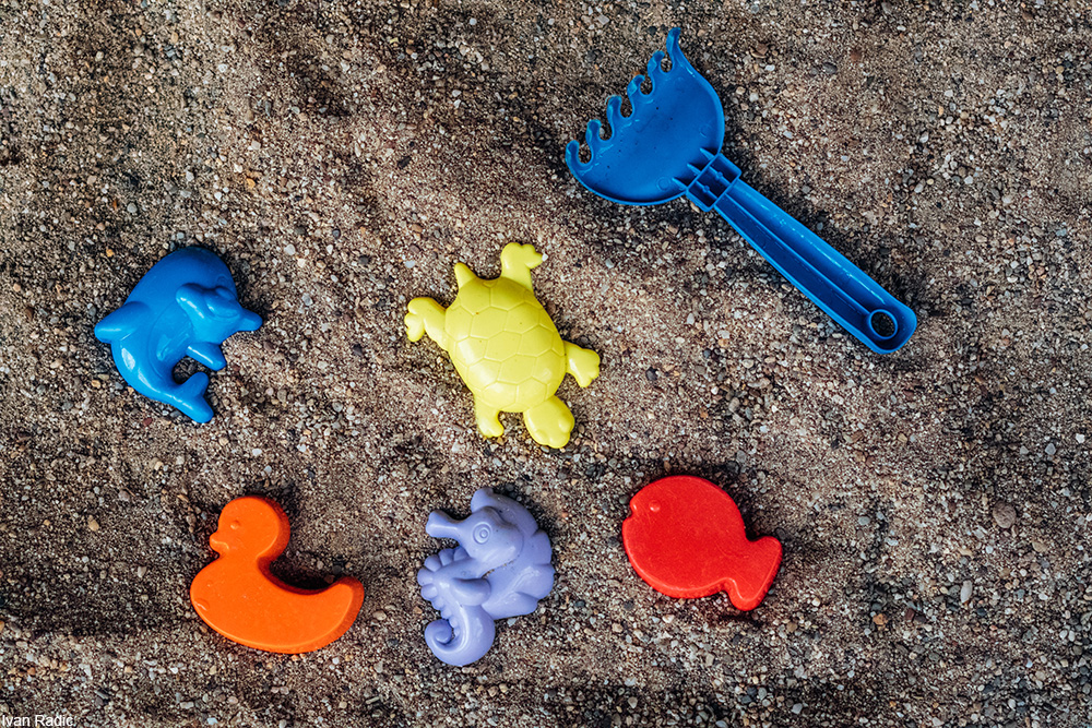 plastic toys in sand
