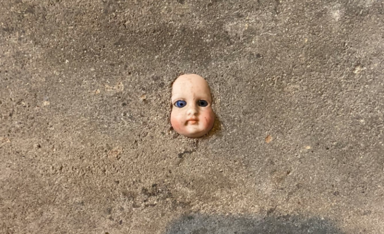 Woman Discovers A Creepy Doll Head In The Wall Of Her New Home