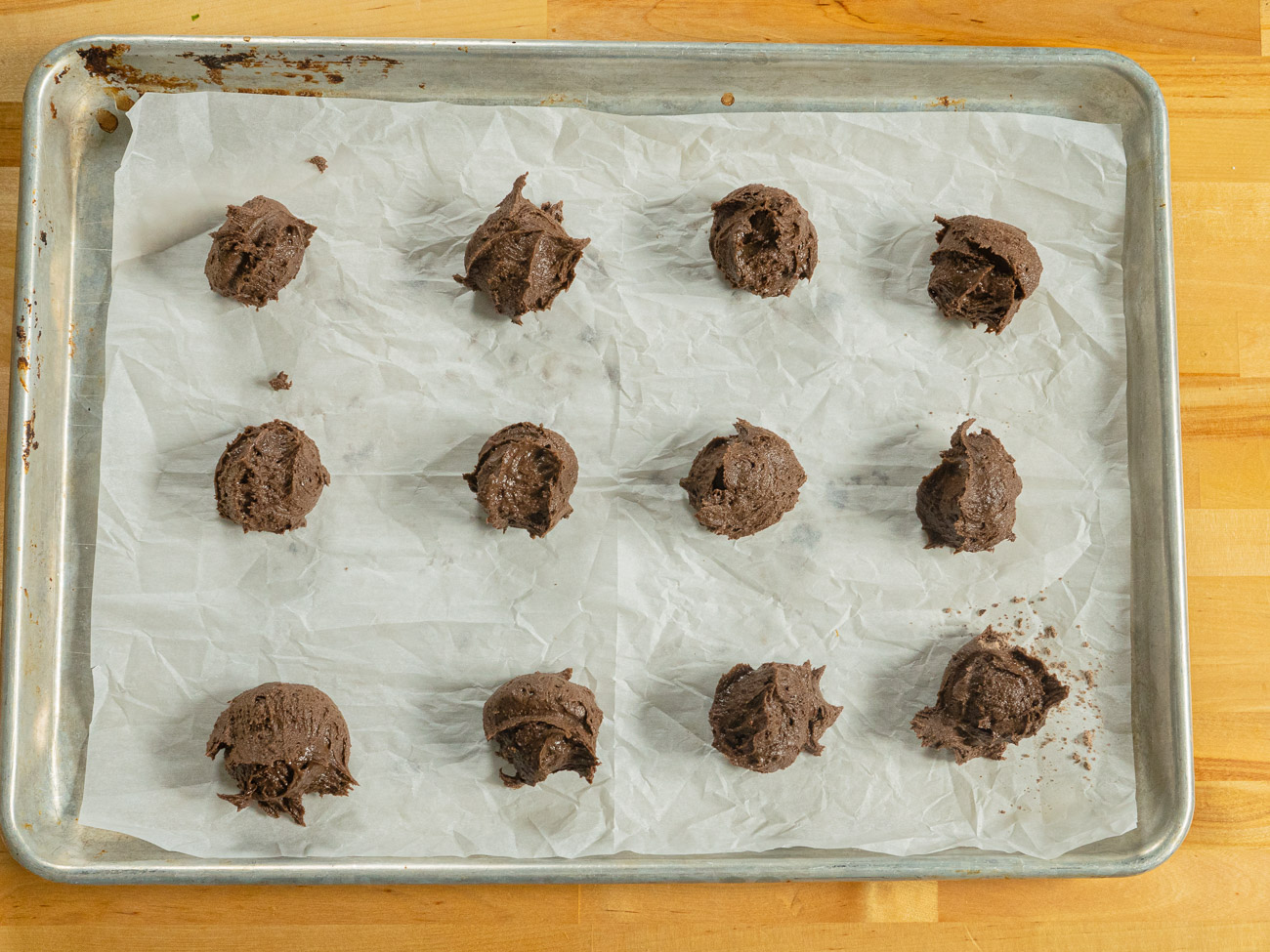 Scoop the dough onto an ungreased cookie sheet. Smooth the edges of each to form a round cookie. Bake for 12 minutes.