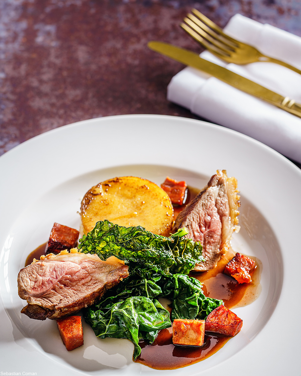 roast beef and vegetables on a white plate