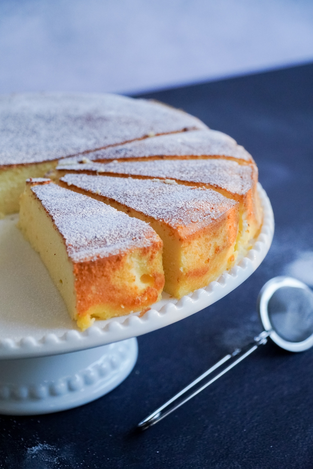 sliced cheesecake on a cake stand