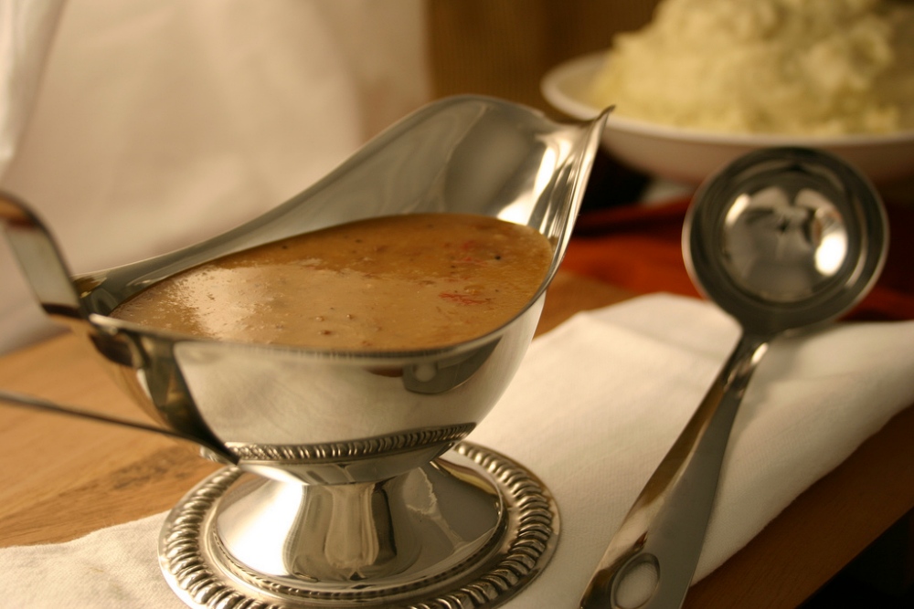 metal gravy boat filled with gravy