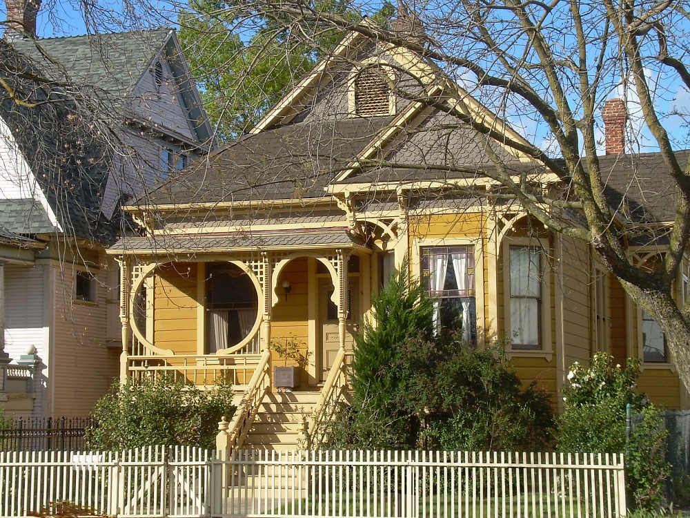 Victorian house with gingerbread details on the front porch