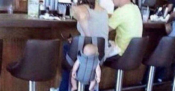Mother Ridiculed After She Straps Her Baby To The Back Of A Barstool To Have A Drink