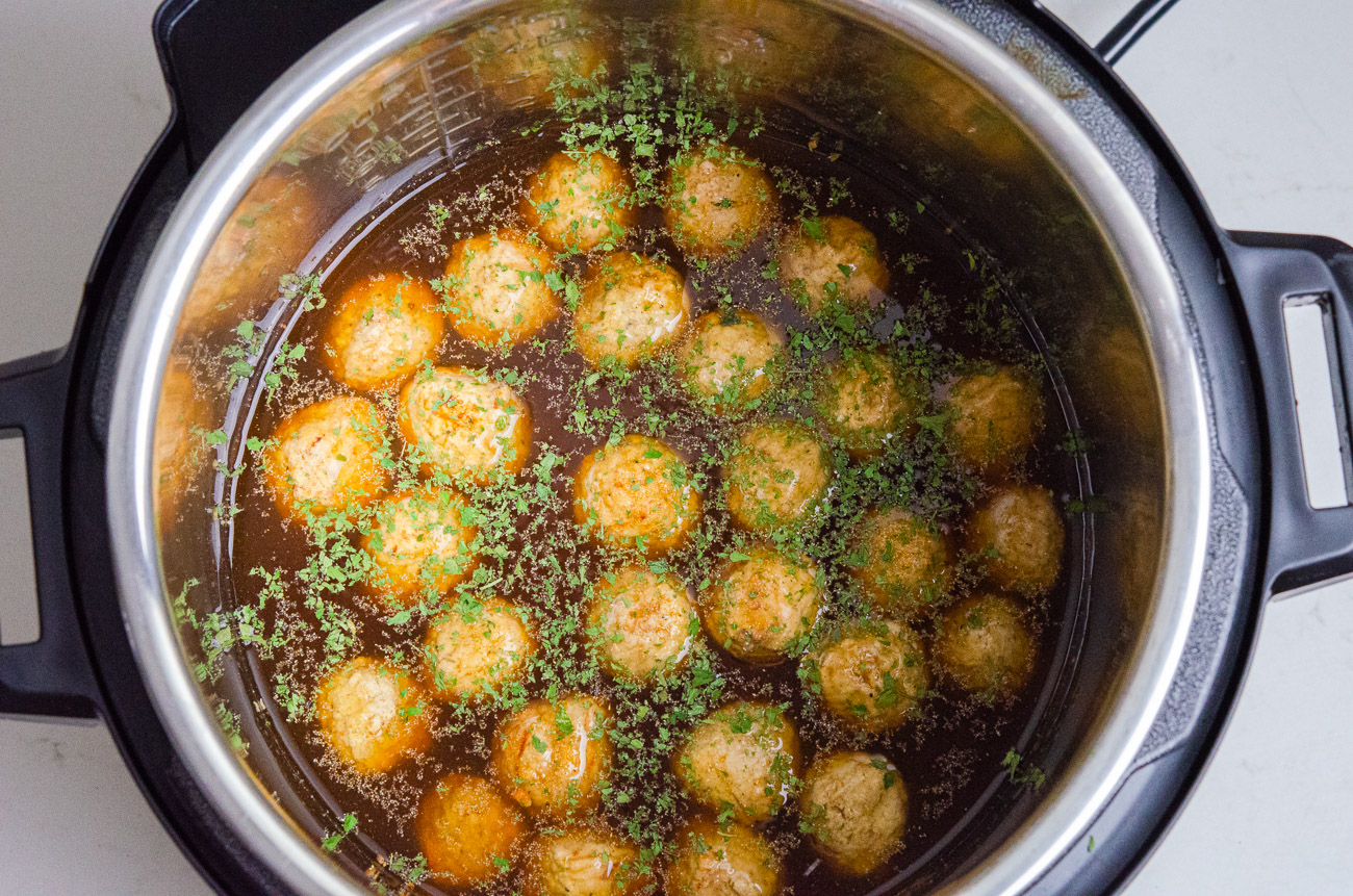 In the insert of your Instant Pot, combine meatballs, beef broth, Worcestershire sauce, garlic powder, parsley, salt and pepper. Stir to combine.