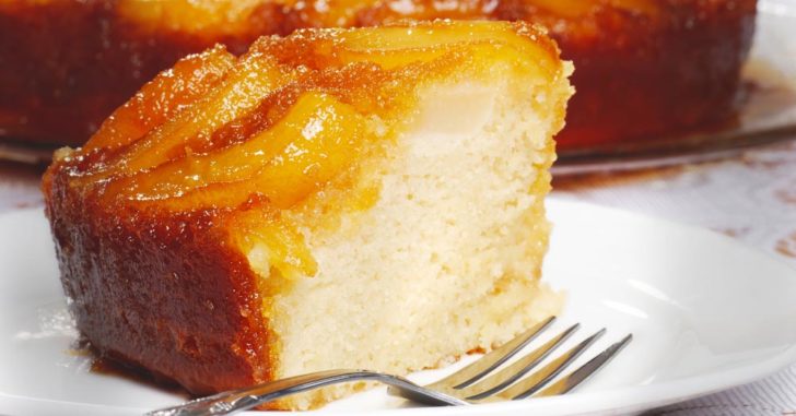 Side view of cake with caramelized peach slices on top