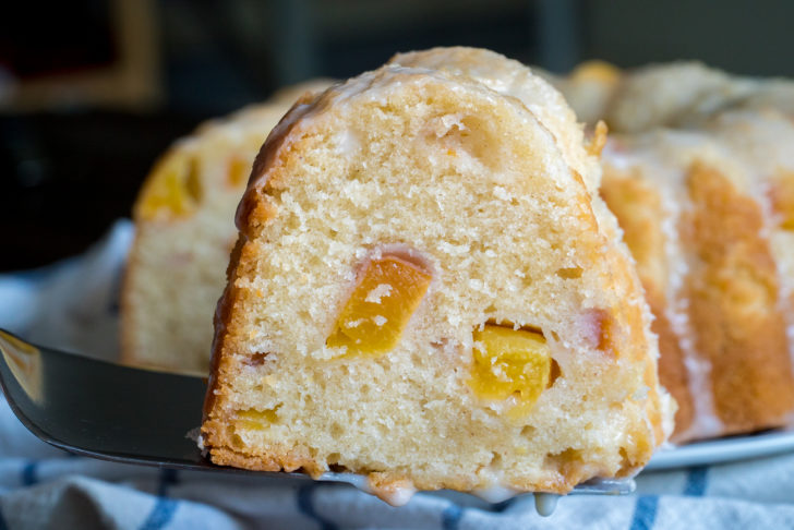 Side view of cake slice with peach chunks