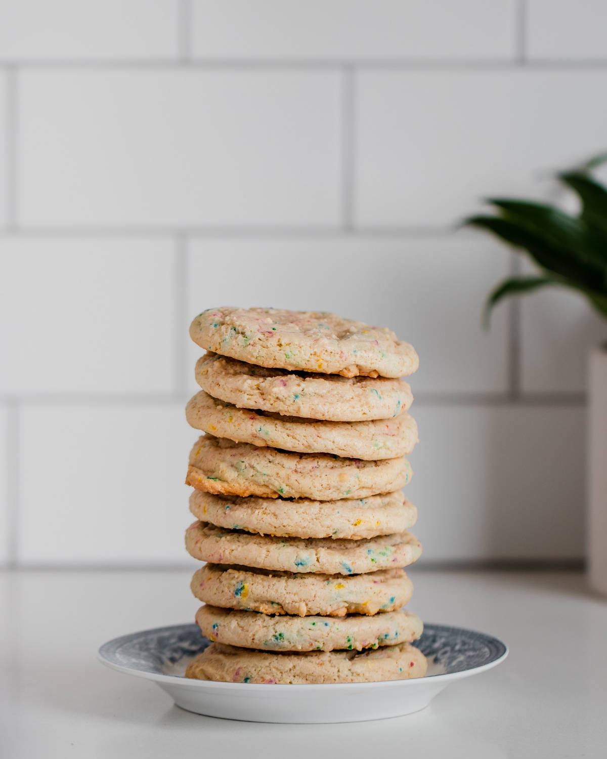 tall stack of cookies on a saucer