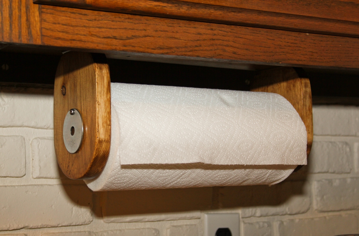 paper towel roll on wooden holder