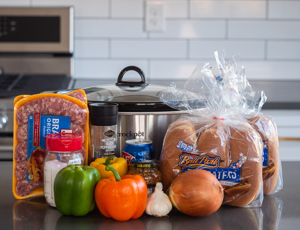 Slow Cooker Brats with Onions and Peppers - Cooking With Carlee