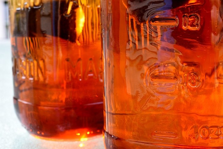 brewed black tea in jars