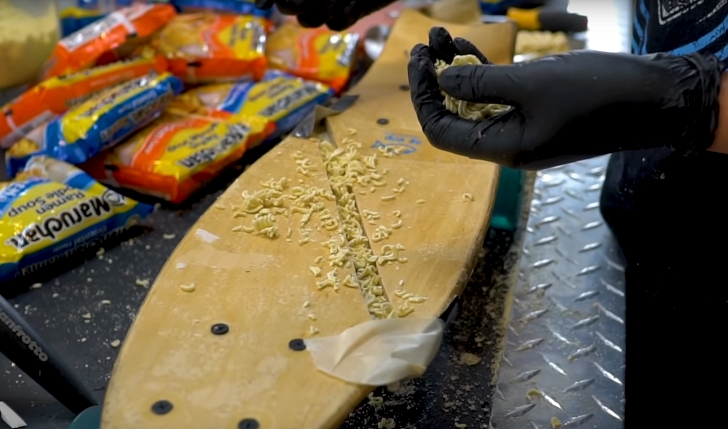 ramen being used to repair a broken skateboard