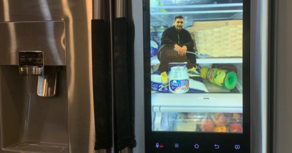 Man Photoshops Himself Onto The Refrigerator Screen To Look Like He’s Trapped Inside