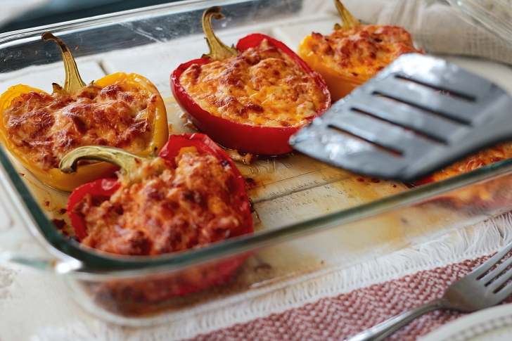 stuffed peppers in a glass baking dish