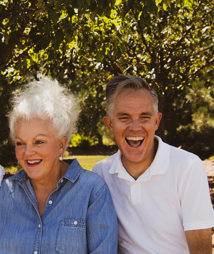 gray hair couple laughing together