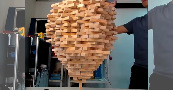 Guy Balances 1,512 Jenga Pieces On One Block And Breaks His Own World Record