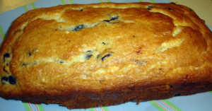 Side view, close up of a baked loaf of blueberry b read