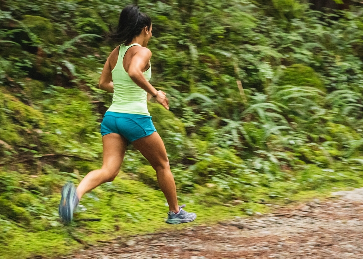 woman running in forest