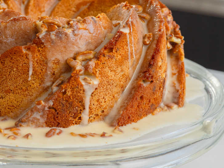 Close up side shot of bundt cake with icing dripping down