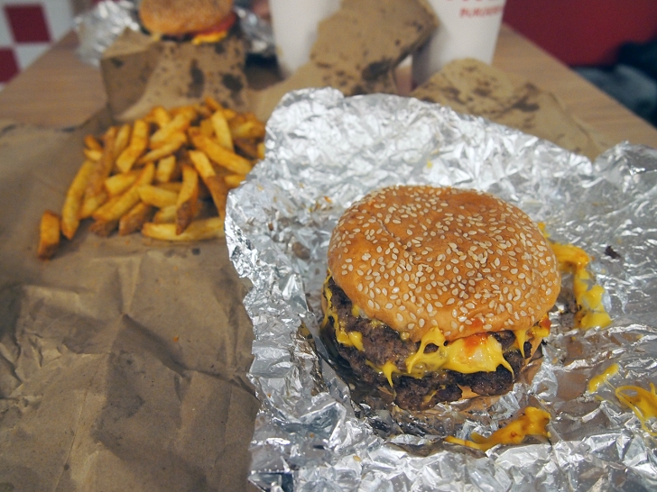 The Real Reason You Always See Bags Of Potatoes Inside Five Guys