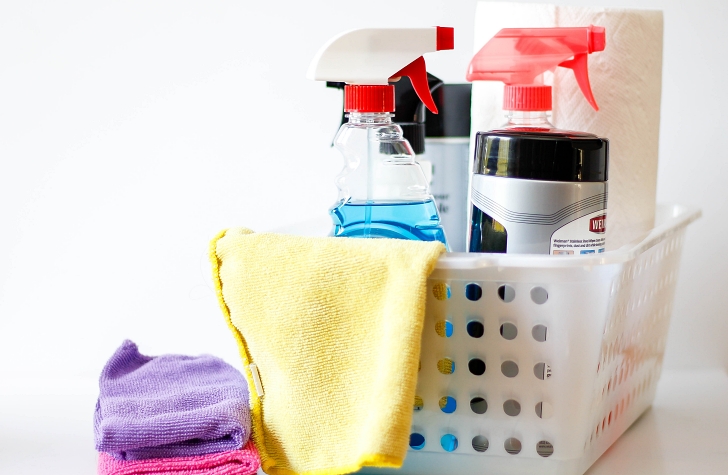 cleaning supples in a plastic basket