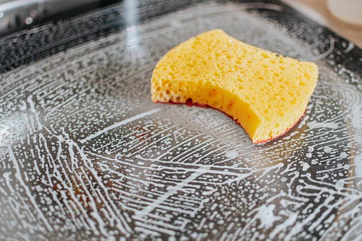 soapy sponge in sink