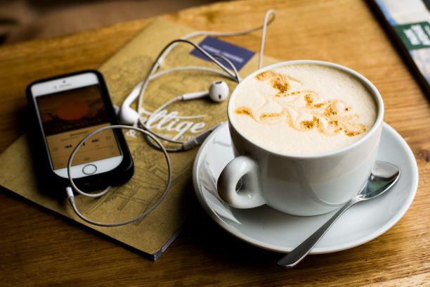 coffee and earbuds