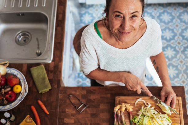 chopping food in kitchen