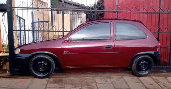 Homeowners Attach Half A Car To Their Gate To Create The Illusion It’s Driving
