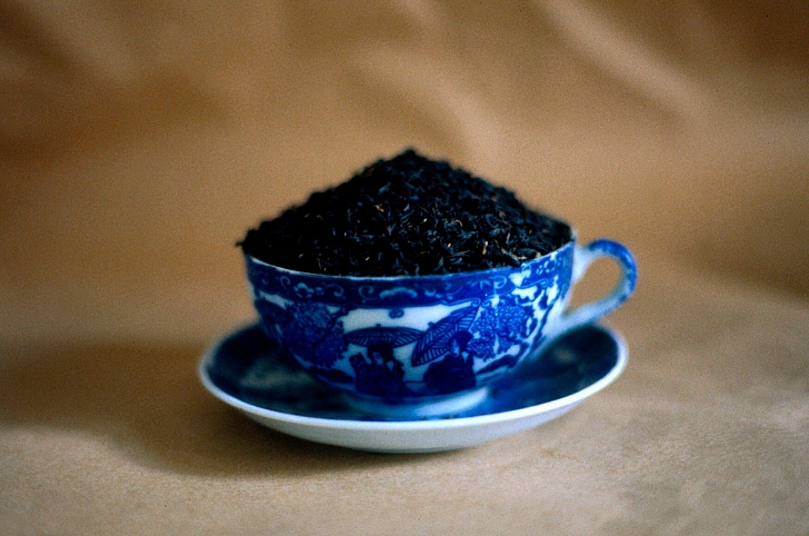 cup of tea filled with loose tea