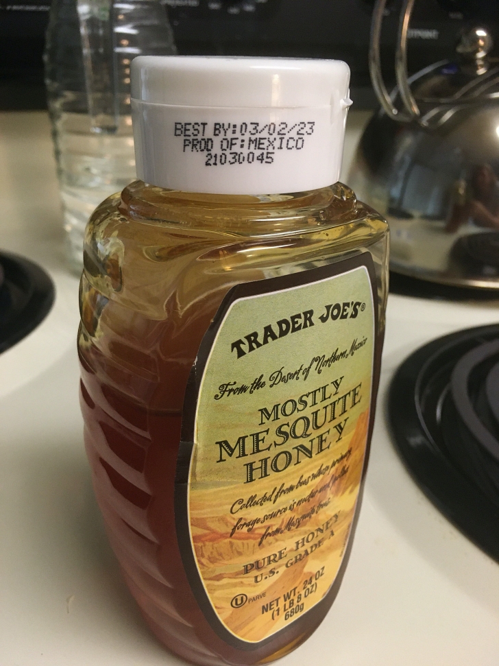 honey bottle on stovetop