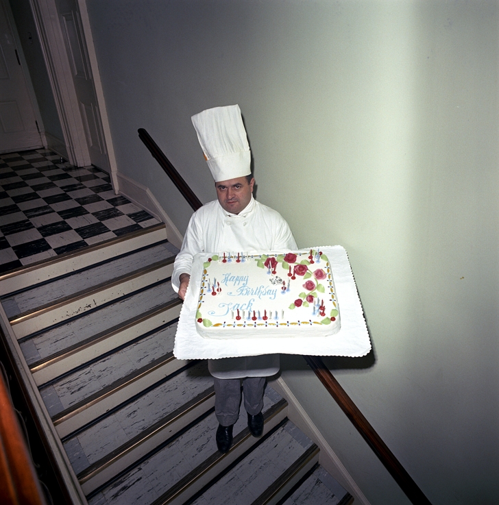 Rene Verdon holding the cake for JFK birthday