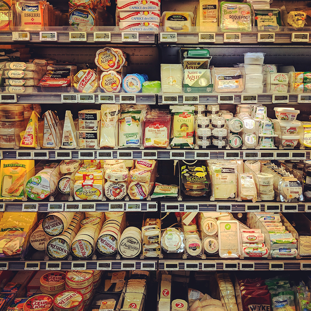aisle of cheese in the grocery store