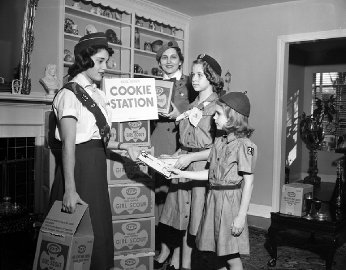 girls scouts with boxes of cookies 1959