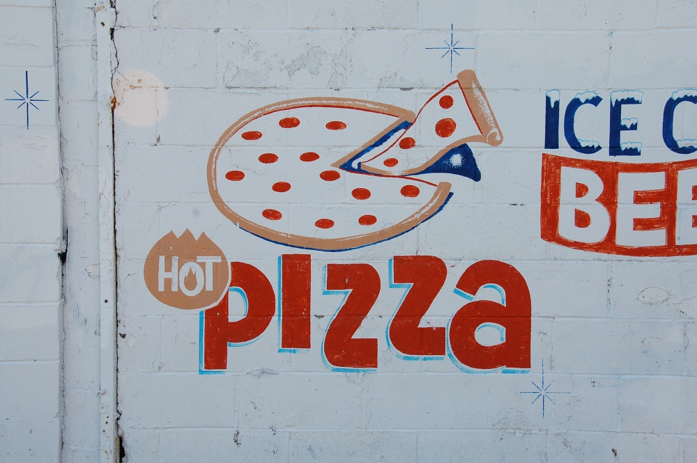 pizza sign on wall