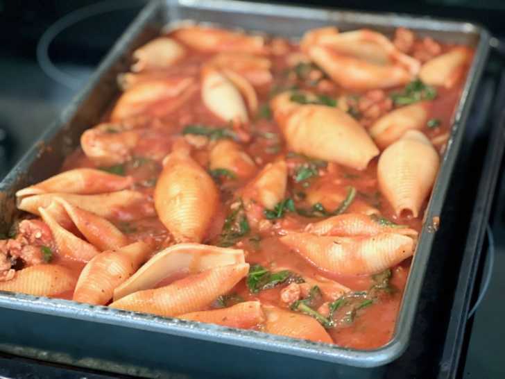 Shells and sauce mixture transfered to baking dish