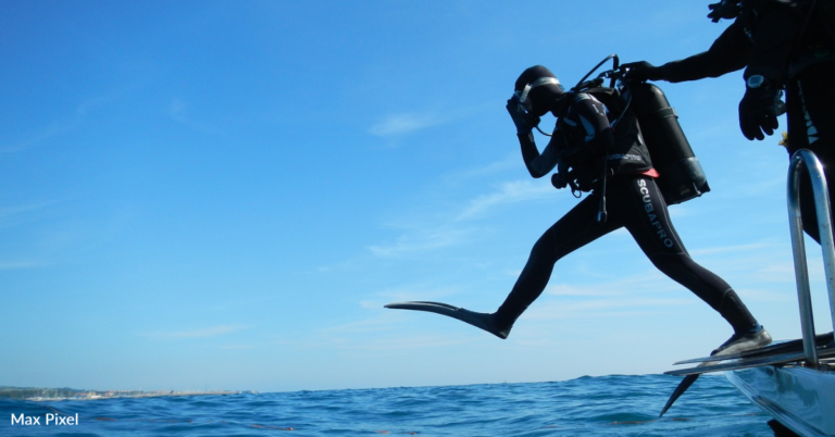 Scuba Divers Carve Pumpkins Underwater