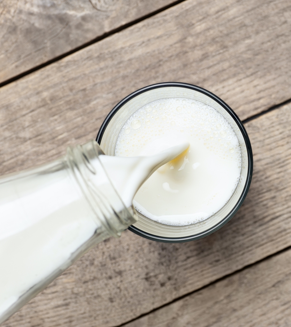 glass of milk being poured