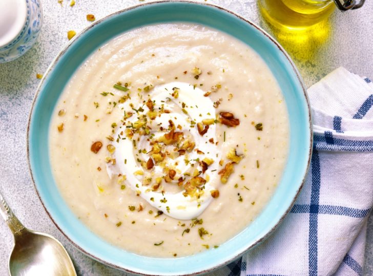 Creamy cauliflower soup with walnuts