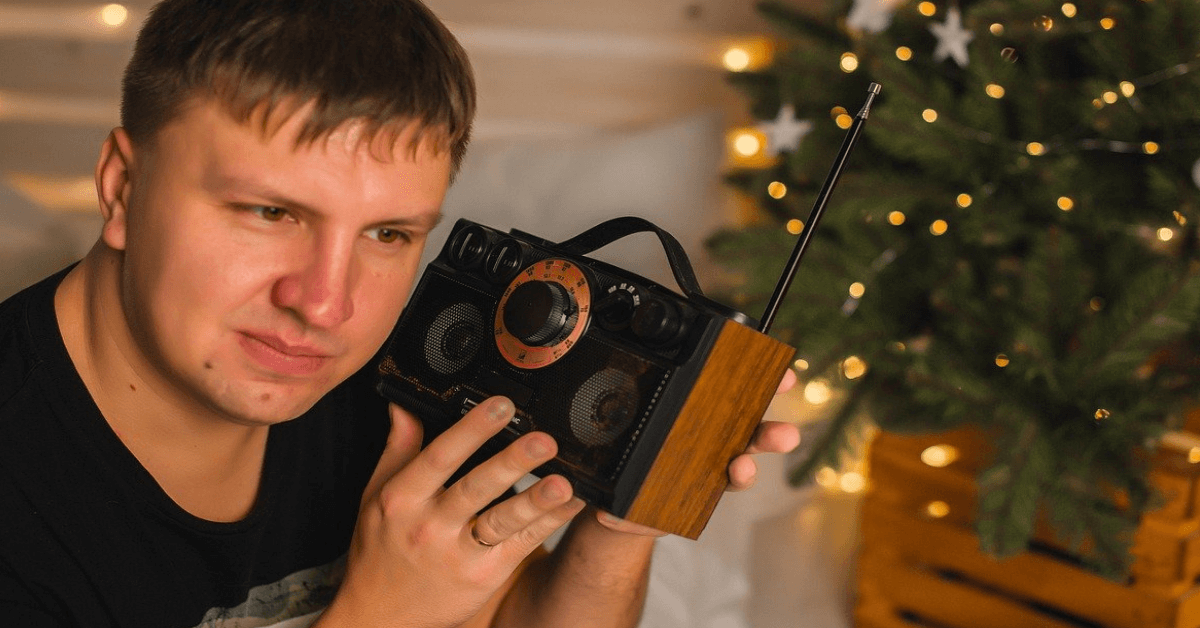 man listening to radio