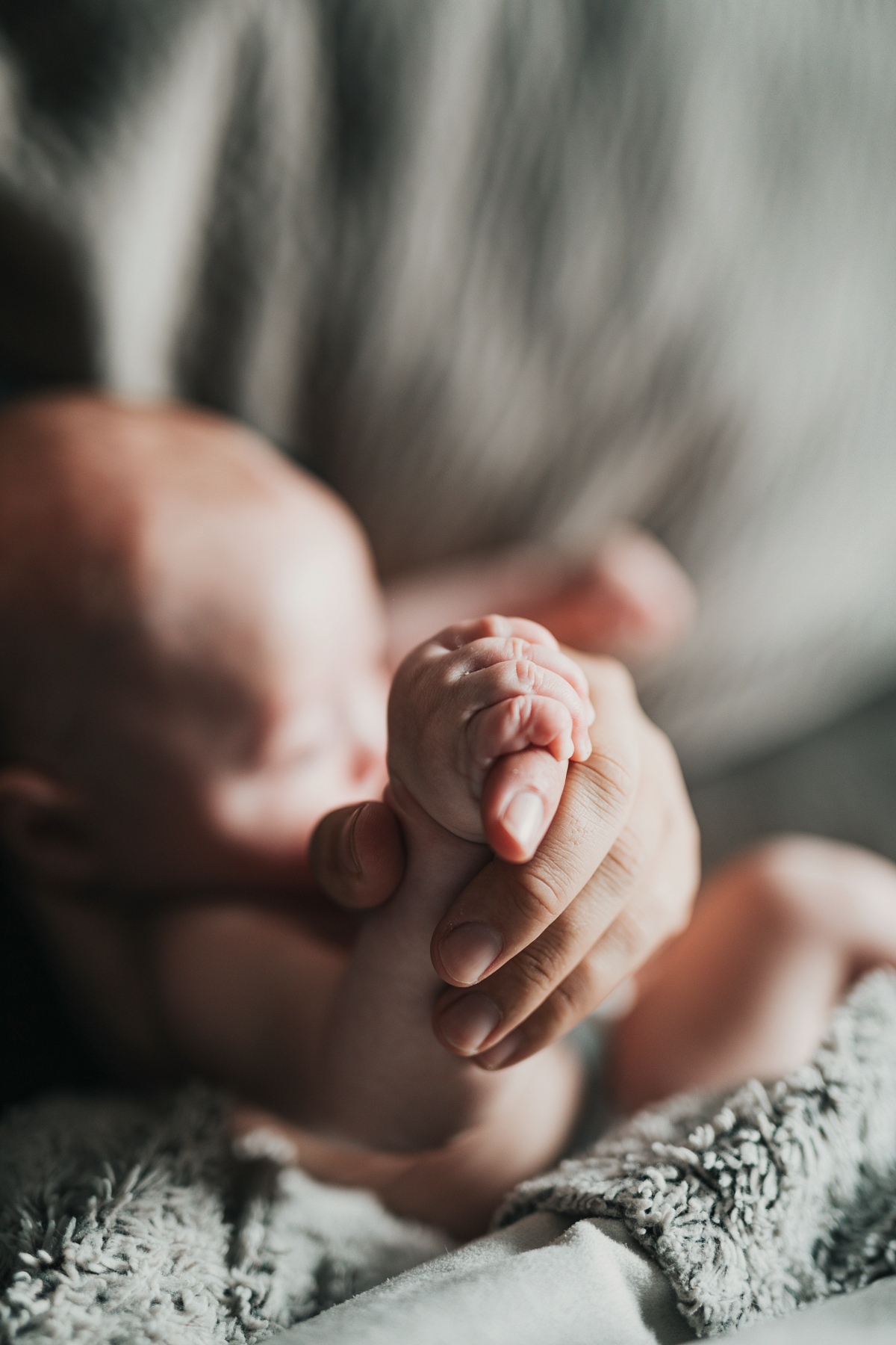 adult holding a baby